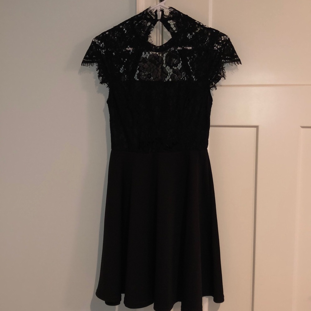 Little black dress with floral lace top and open back